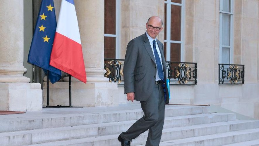 Pierre Moscovici quitte le palais de l'Elysée, le 1er octobre 2013