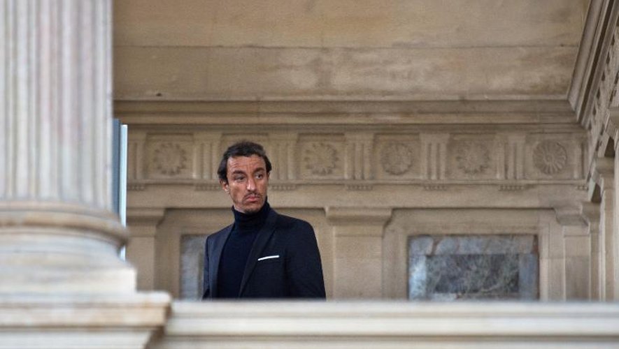 L'ancien avocat Karim Achoui au palais de justice de Paris le 17 septembre 2013, au premier jour du procès de six hommes, accusés d'avoir tenté de l'assassiner