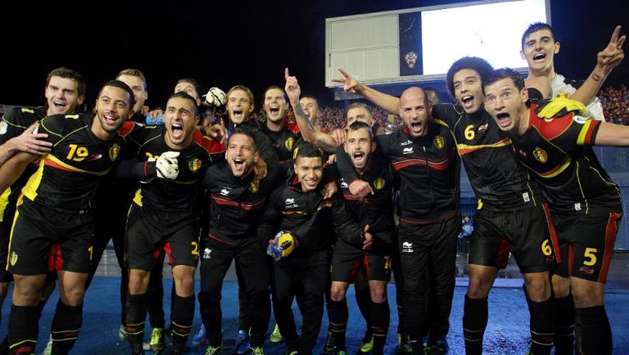 Les joueurs belges fêtent leur qualification pour le Mondial-2014 au Brésil, après leur victoire en Croatie, le 11 octobre 2013 à Zagreb