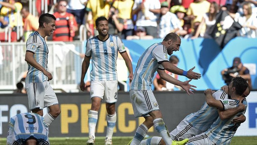 Les joueurs argentins laissent éclater leur joie après leur victoire en quart de finale face à la Belgique, le 5 juillet 2014 à Brasilia