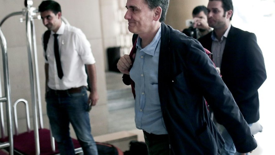 Le ministre grec des Finances Euclid Tsakalotos arrives dans un grand hôtel d'Athènes, le 9 août 2015