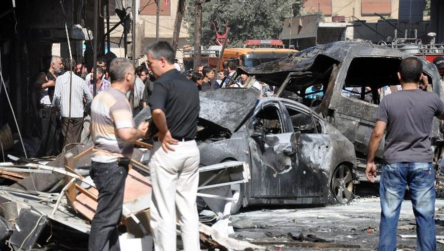 Photo diffusée par l'agence officielle syrienne Sana le 25 juillet 2013 d'un attentat à Jaramana, une banlieue de Damas