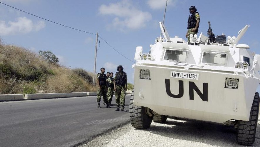 Des soldats de la paix de la Force d'Intérim des Nations Unies au Liban (UNIFIL) le 13 juillet 2014 à Nakura, au sud du Liban, en patrouille à la frontière avec Israël
