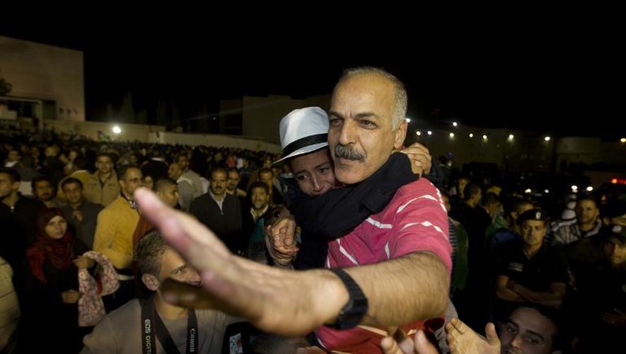 Un Palestinien à son arrivée le 30 octobre 2013 à Ramallah après sa libération par Israël