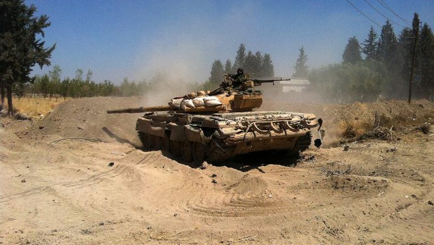 Un char de l'armée syrienne dans la région de la Ghouta orientale, à l'est de Damas, le 30 août 2013