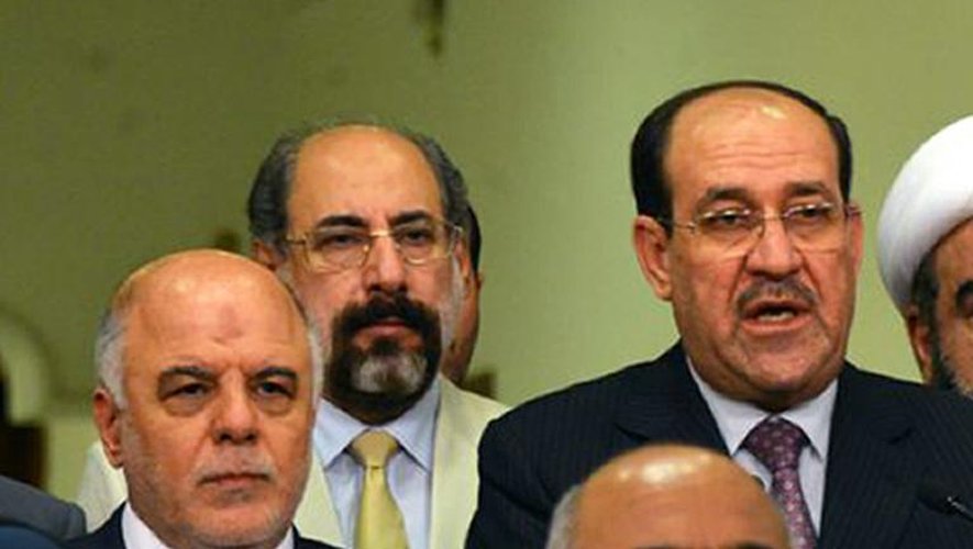 Le Premier ministre irakien Nuri al-Maliki annonce son départ au profit de son successeur Haidar al-Abadi (l), le 15 août 2014