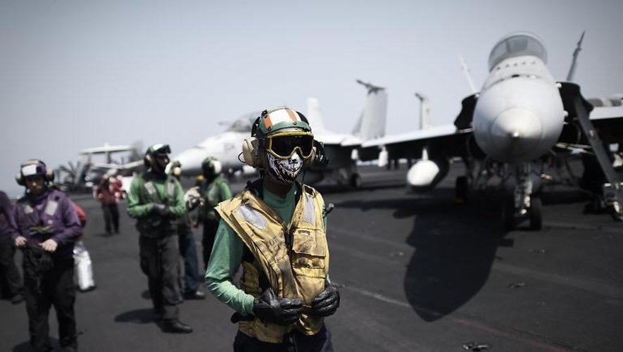 Des soldats américains sur le porte-avions George H.W. Bush, le 15 août 2014 naviguant dans les eaux du Golfe