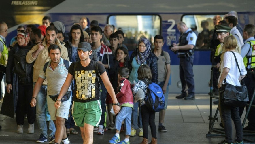 Des migrants arrivent à la gare de Munich, le 12 septembre 2015, en Allemagne