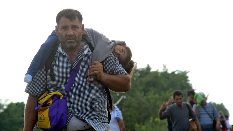 Des réfugiés le 14 septembre 2015 à Horgos en Serbie à la frontière avec la Hongrie
