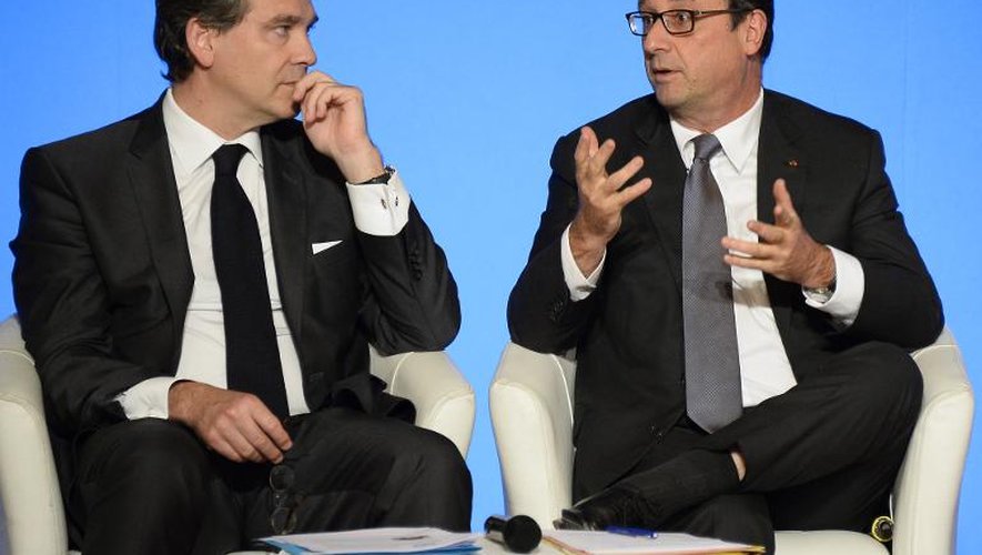 Arnaud Montebourg et Francois Hollande le 23 juillet 2014 à l'Elysée à Paris