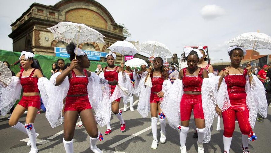 Des participants au carnaval de Notting Hills, le 24 août 2014 à Londres