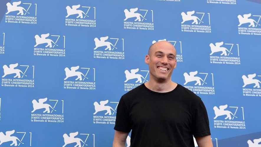 Le réalisateur américain du documentaire "The Look of Silence", Joshua Oppenheimer, lors de la présentation de son film, à Venise le 28 août 2014