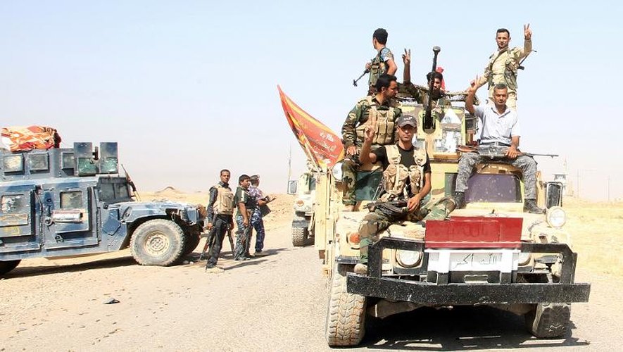 Les forces irakiennes combattant les extrémistes sunnites de l'EI arrivent pour prodiguer assistance aux habitants d'Amerli, ville turcomane chiite, à 160 km au nord de Bagdad, le 2 septembre 2014