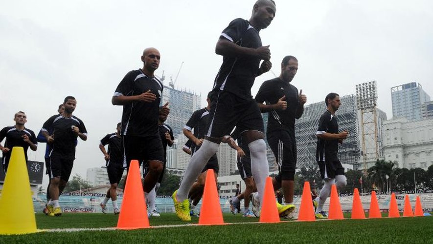 Les joueurs de l'équipe de Palestine participent à un entraînement, lors du tournoi sur invitation organisé à Manille, le 4 septembre 2014