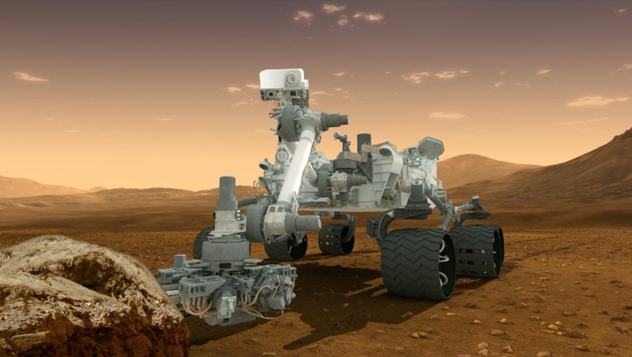 Vue d'artiste fournie par la Nasa le 1er août 2012, qui montre le robot Curiosity, chargé de découvrir des preuves de possibilité de vie sur Mars