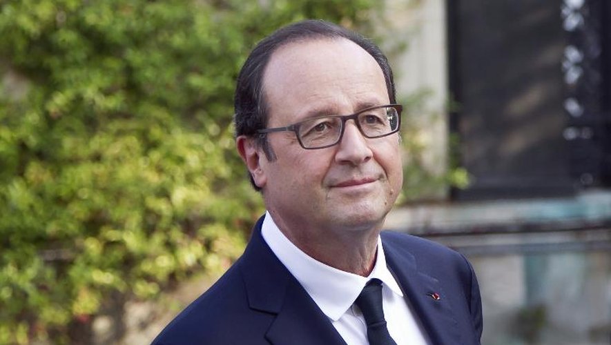 François Hollande après un entretien avec Laurent Fabius, à Paris le 15 septembre 2014