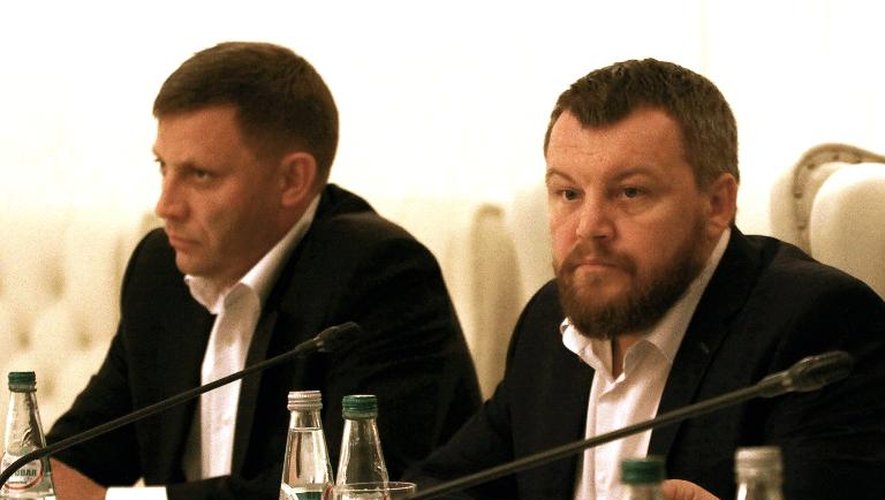 Le "Premier ministre" de la République unilatéralement proclamée de Donetsk (DNR), Alexandre Zakhartchenko et et le "vice-Premier ministre" Andrei Purgin le 19 septembre 2014 à Minsk