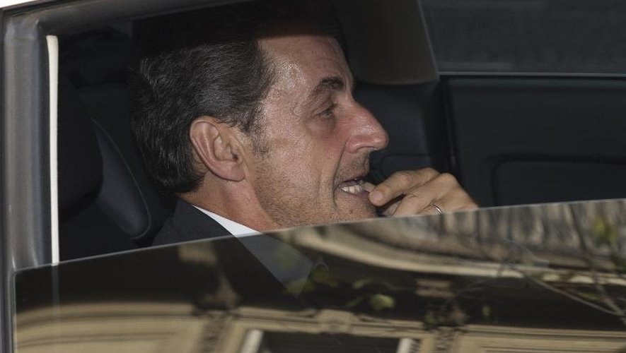 Nicolas Sarkozy à la sortie de son bureau le 19 septembre 2014 à Paris