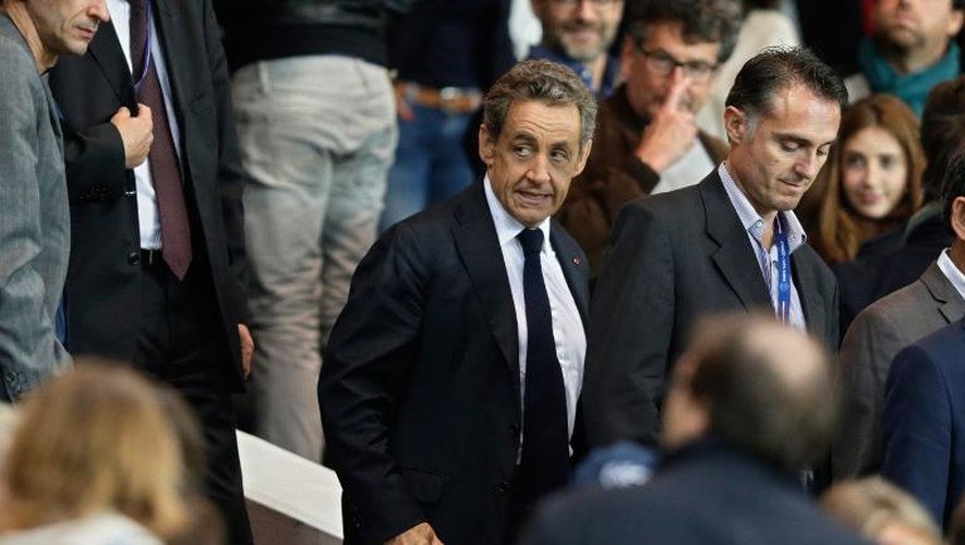 Nicolas Sarkozy à son arrivée le 21 septembre 2014 au Parc des Princes à Paris, après son intervention sur France 2