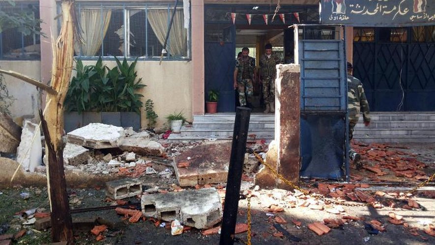 Image de l'agence SANA après l'explosion d'une bombe près d'une école à Homs, le 1er octobre 2014