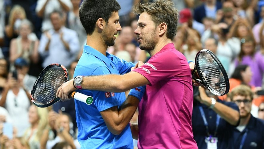 Novak Djokovic et Stan Wawrinka à l'issue de la finale de l'US Open le 11 septembre 2016 à New York