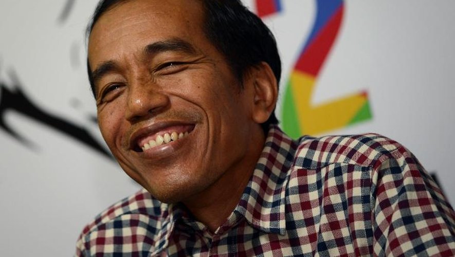Joko Widodo sourit lors d'une conférence de presse le 10 juillet 2014 à Jakarta