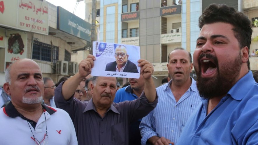 Des manifestent dénoncent l'assassinat à Amman de l'écrivain jordanien Nahed Hattar, le 25 septembre 2016 à Fuheis, au nord-ouest de la capitale