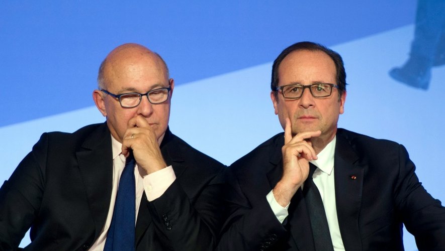 Michel Sapin et François Hollande le 15 septembre 2014 à l'Elysée à Paris