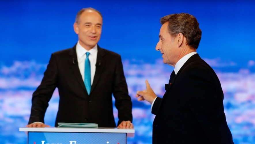Jean-François Copé et Nicolas Sarkozy lors du  premier débat télévisé de la primaire de la droite, le 13 octobre 2016 dans les studios de TF1 à La Plaine-Saint-Denis