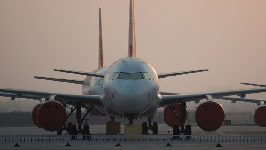 (FILES) This file picture taken on March 1, 2016 shows parked aircraft at the Airbus Tianjin plant in Tianjin. 
Aerospace giants Boeing and Airbus took potshots at one another at the Zhuhai air show on November 2, 2016, as the US and European rivals seek to capture more of China's booming aircraft market. / AFP PHOTO / FRED DUFOUR / TO GO WITH AFP STORY CHINA-US-EU-TRADE-AVIATION,FOCUS BY BENJAMIN CARLSON