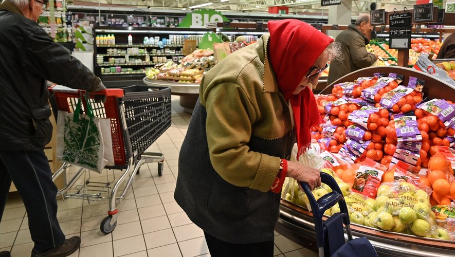 People shop in a supermarket open one hour only for the elderly and vulnerabl